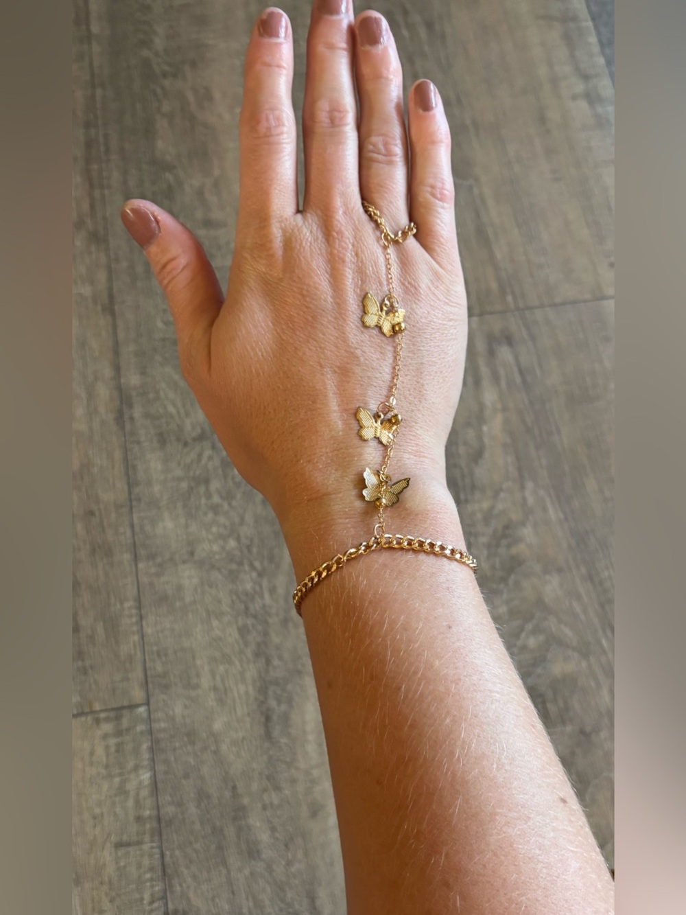 Women’s gold tone butterfly hand chain bracelet